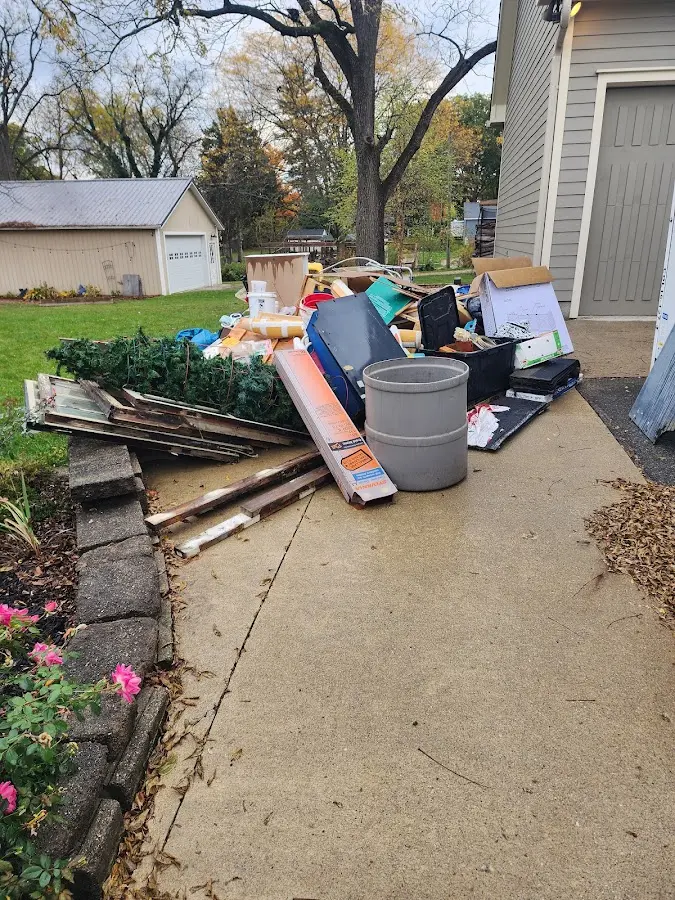 Dumpster being loaded with debris for Commercial Dumpster Rental in Olympia Fields